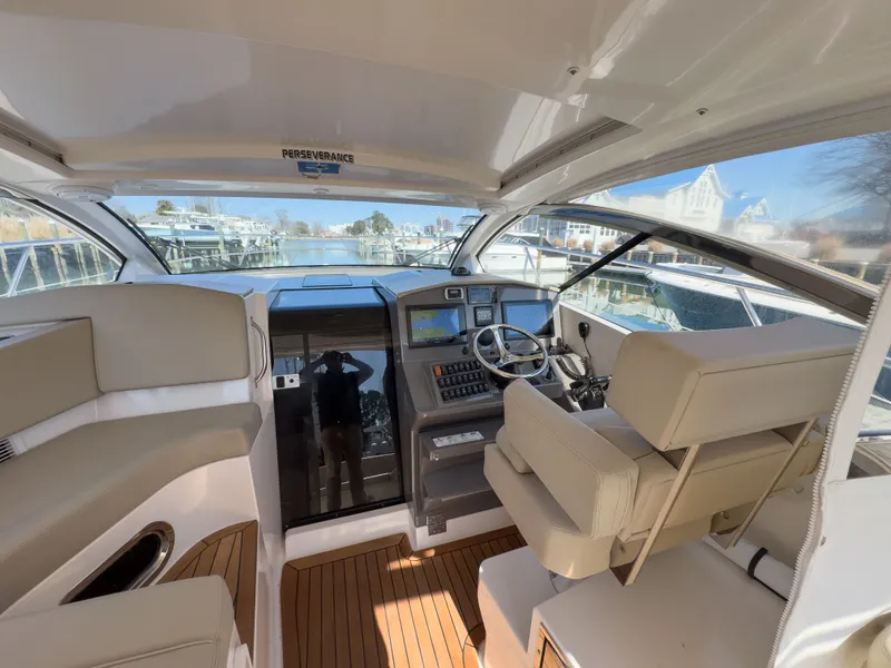 Slide: The Image of Interior of 2015 Pursuit SC 365i Sport Coupe with helm station. - 15