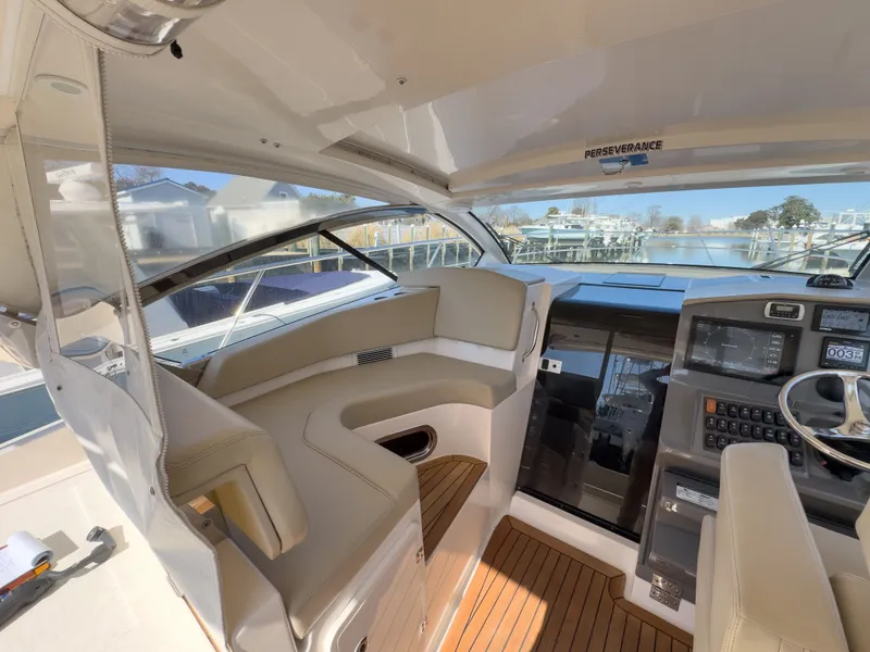 Slide: The Image of Interior of 2015 Pursuit SC 365i Sport Coupe with helm station. - 17