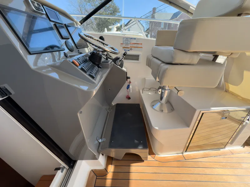 Slide: The Image of Interior view of 2015 Pursuit SC 365i Sport Coupe cockpit. - 19