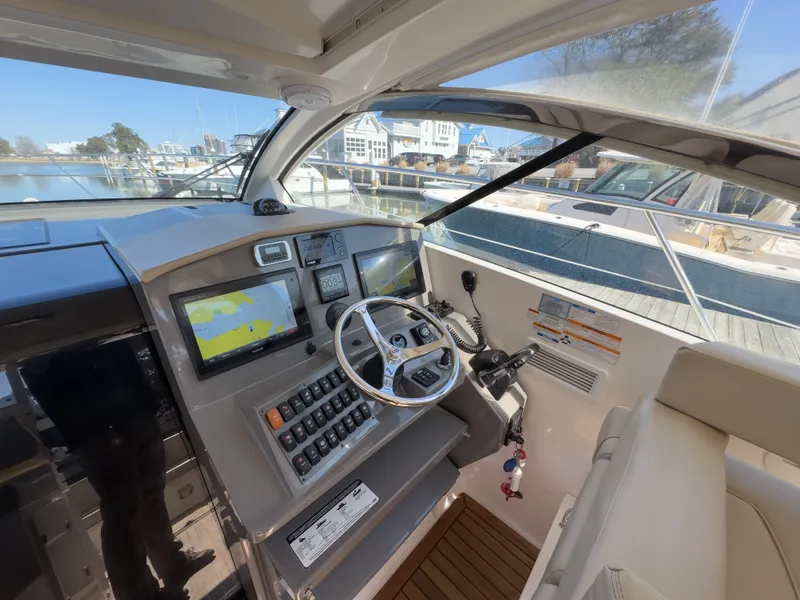 Slide: The Image of Interior view of 2015 Pursuit SC 365i Sport Coupe cockpit. - 2