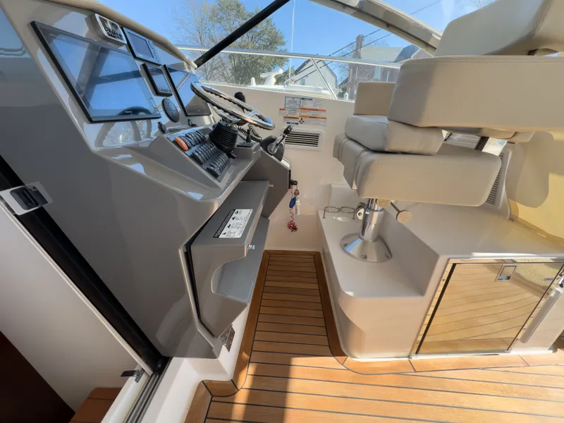 Slide: The Image of Interior of 2015 Pursuit SC 365i Sport Coupe with helm console. - 20