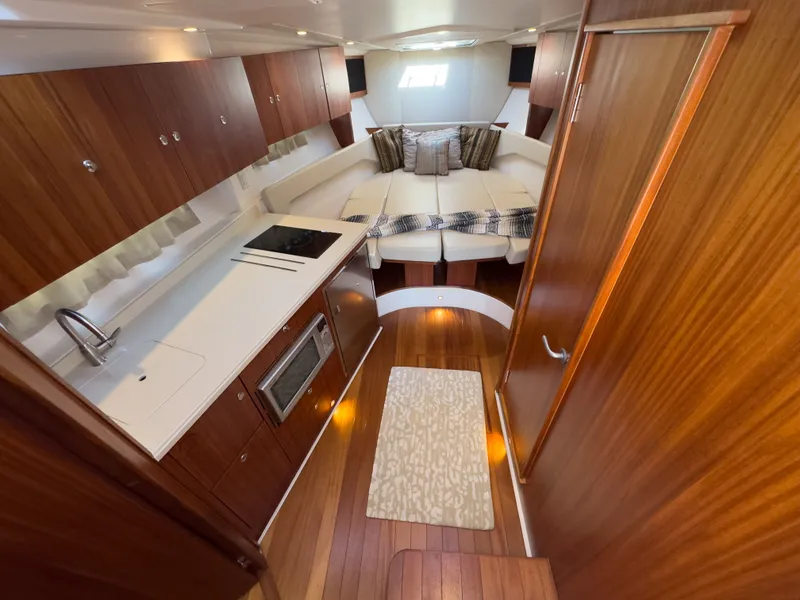 Slide: The Image of Interior of 2015 Pursuit SC 365i Sport Coupe with kitchen and seating area. - 21