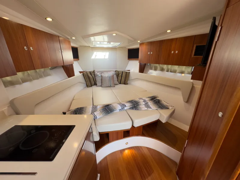 Slide: The Image of Interior of 2015 Pursuit SC 365i Sport Coupe with cozy seating area. - 23