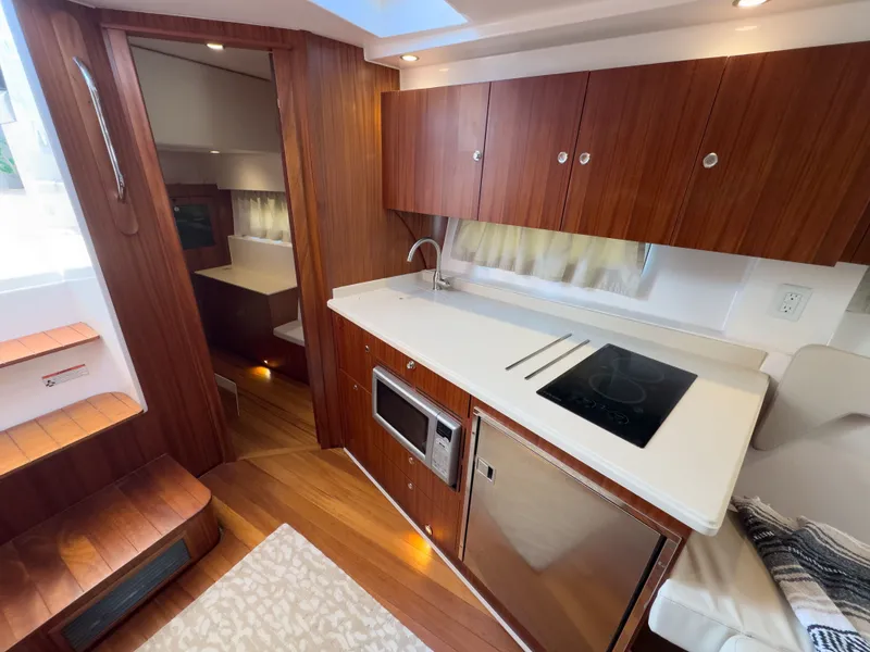 Slide: The Image of Interior of 2015 Pursuit SC 365i Sport Coupe with modern kitchen. - 24