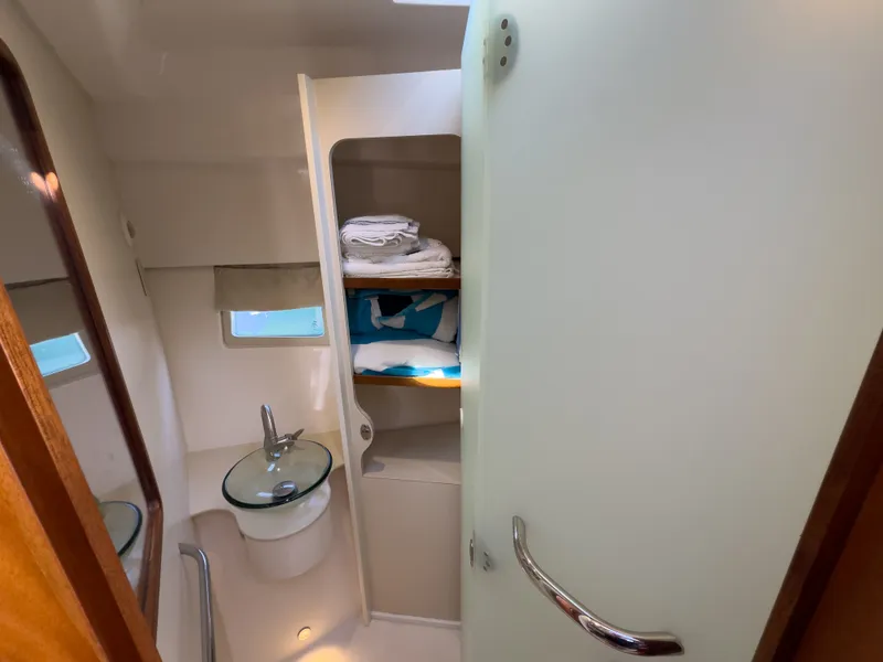 Slide: The Image of Bathroom in 2015 Pursuit SC 365i Sport Coupe with glass sink. - 27