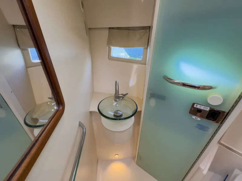 Slide: The Image of Bathroom in 2015 Pursuit SC 365i Sport Coupe with glass sink. - 28
