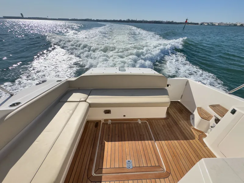 Slide: The Image of Rear view of Pursuit SC 365i Sport Coupe on the water. - 3