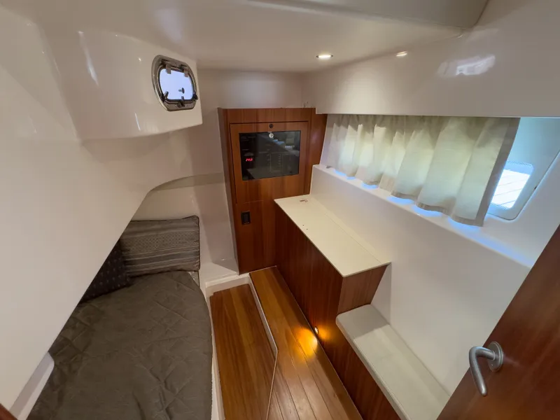 Slide: The Image of Interior of 2015 Pursuit SC 365i Sport Coupe with wood flooring. - 36