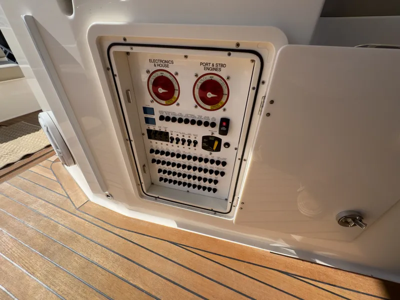 Slide: The Image of Electrical panel on 2015 Pursuit SC 365i Sport Coupe. - 47