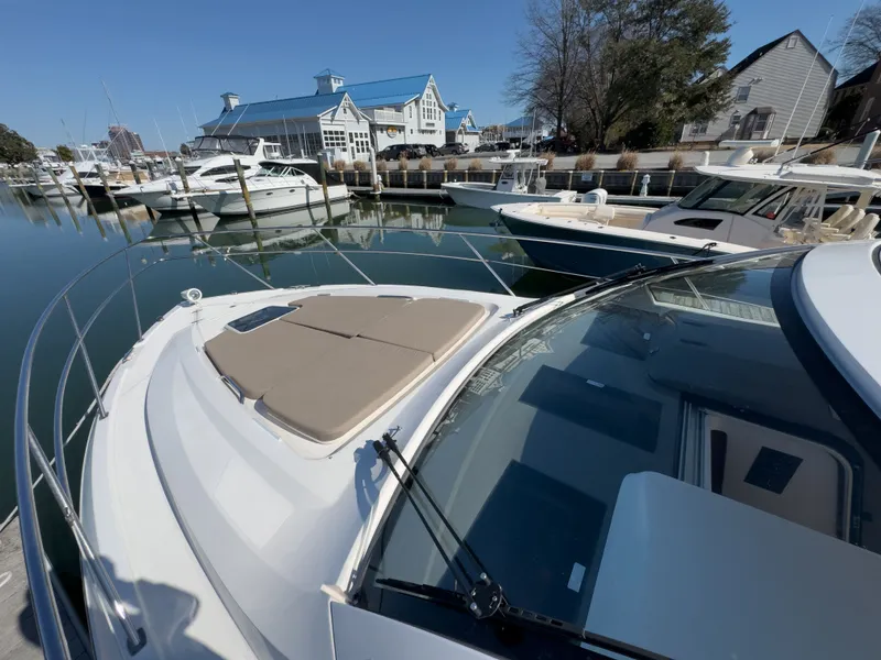 Slide: The Image of 2015 Pursuit SC 365i Sport Coupe docked, sunny day. - 48