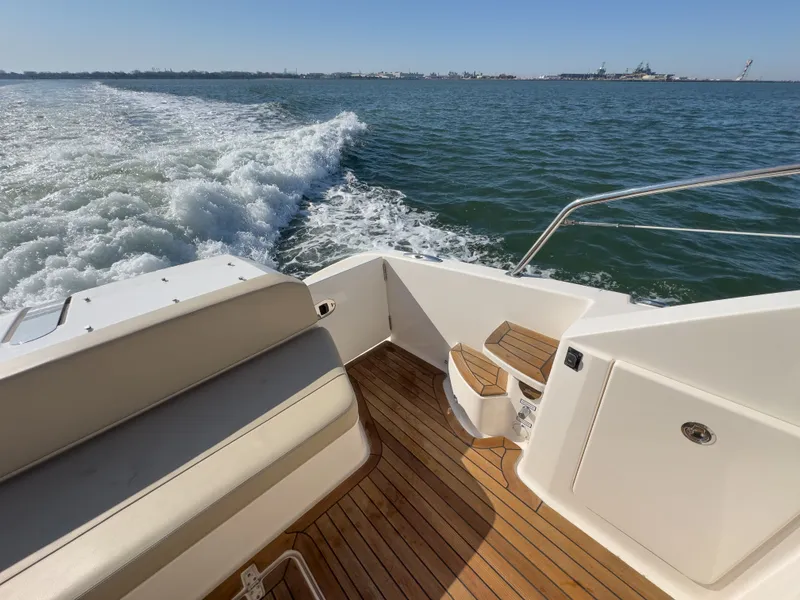 Slide: The Image of Pursuit SC 365i Sport Coupe 2015 cruising on open water. - 8
