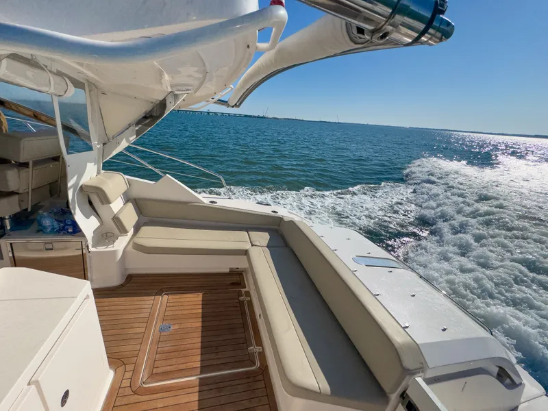 Slide: The Image of 2015 Pursuit SC 365i Sport Coupe cruising on open water. - 9