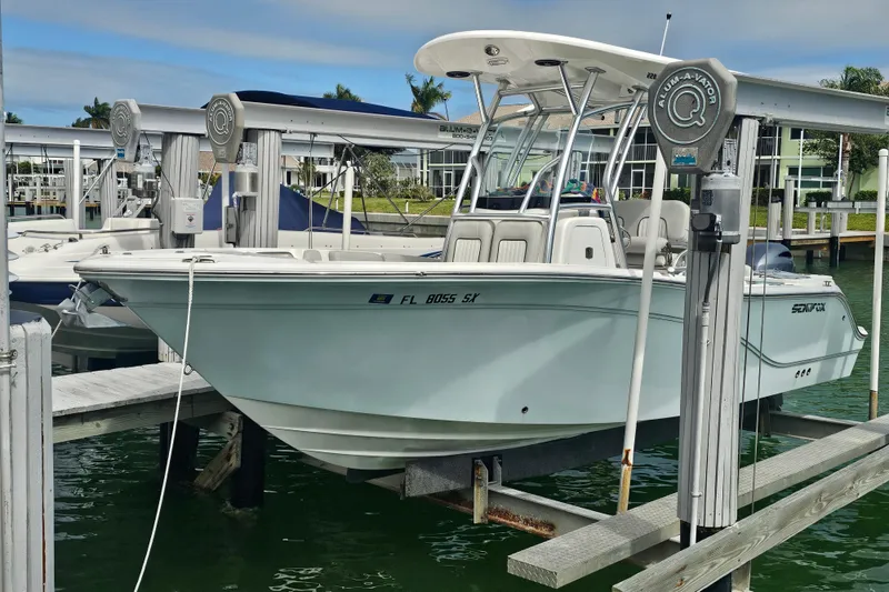 The Image of 2020 Sea Fox 228 Commander boat docked on a lift in a marina. - 0