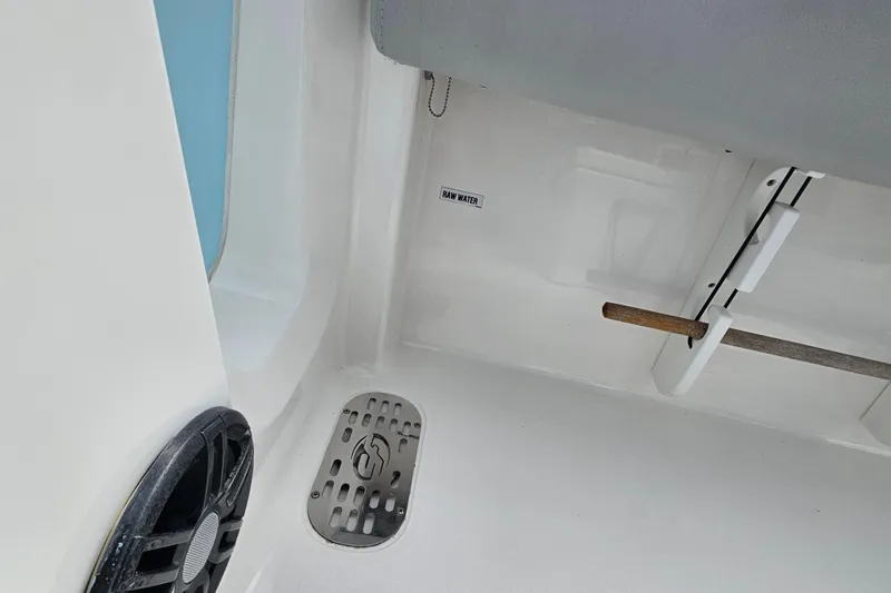 Slide: The Image of Interior view of a 2020 Sea Fox 228 Commander boat, featuring a speaker and drainage area. - 13
