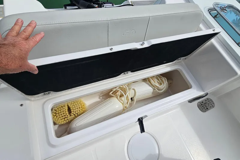 Slide: The Image of Storage compartment on a 2020 Sea Fox 228 Commander boat with cleaning supplies. - 14