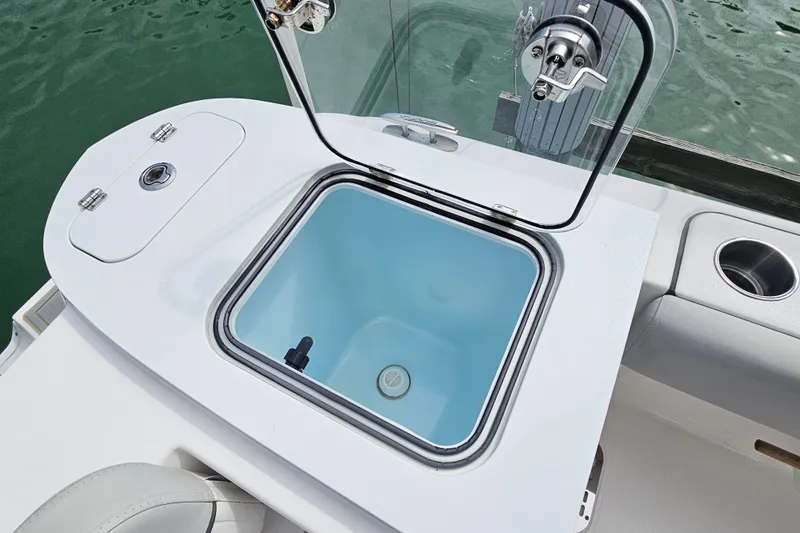 Slide: The Image of Open livewell on 2020 Sea Fox 228 Commander boat, showcasing interior and fishing features. - 15