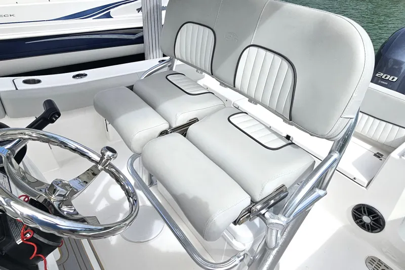 Slide: The Image of 2020 Sea Fox 228 Commander boat interior with dual seats and steering wheel. - 21