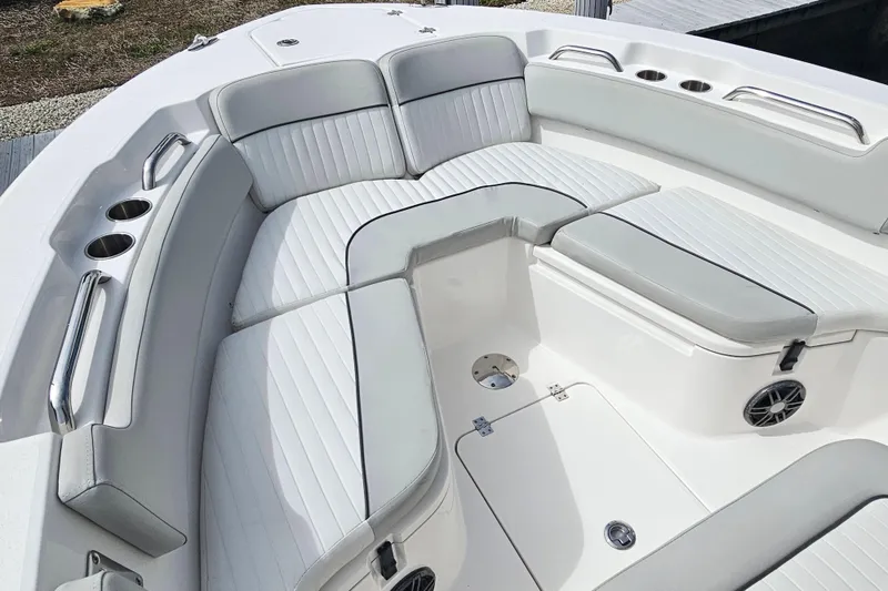 Slide: The Image of 2020 Sea Fox 228 Commander boat interior with cushioned seating and cup holders. - 22