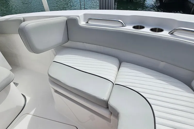 Slide: The Image of 2020 Sea Fox 228 Commander boat interior with cushioned seating and cup holders. - 23