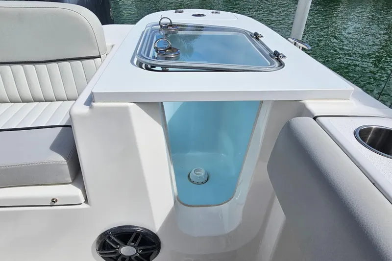 Slide: The Image of 2020 Sea Fox 228 Commander boat interior with seating and storage compartment. - 24