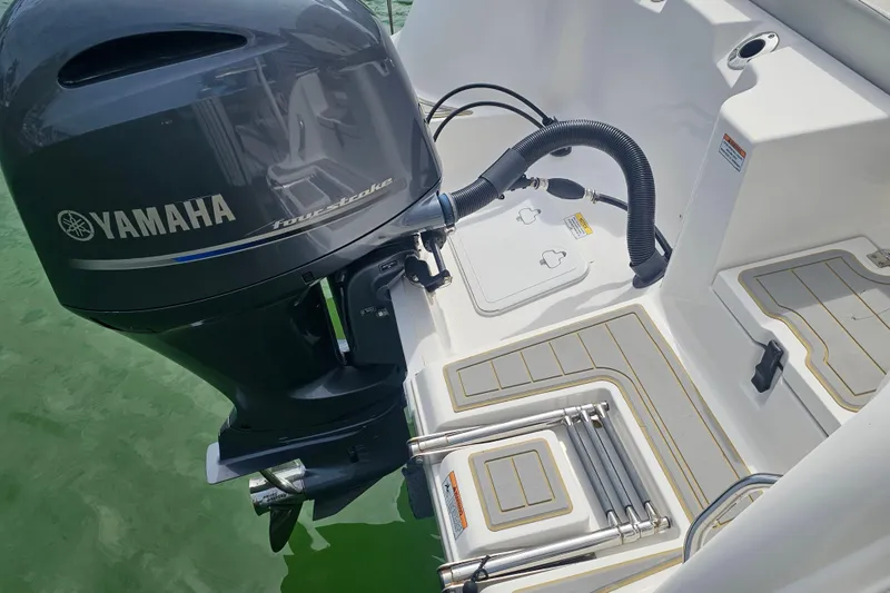 Slide: The Image of 2020 Sea Fox 228 Commander with Yamaha four-stroke engine, featuring swim platform and ladder. - 4