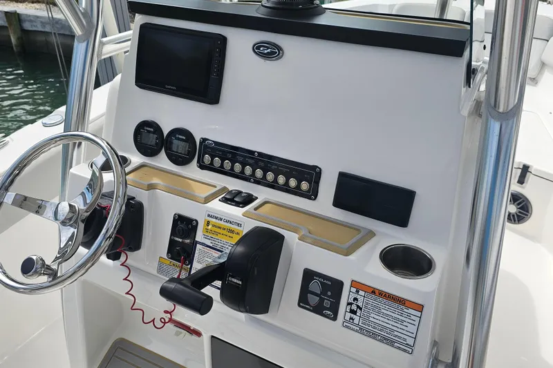 Slide: The Image of 2020 Sea Fox 228 Commander boat dashboard with steering wheel and controls. - 5