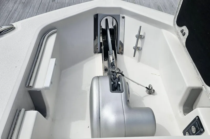 Slide: The Image of Anchor compartment of 2020 Sea Fox 228 Commander boat, featuring a winch and chain. - 8