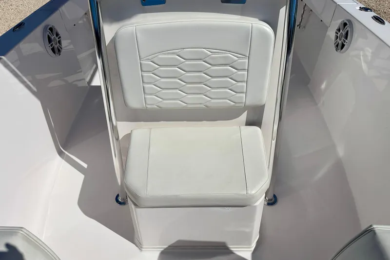 Slide: The Image of 2023 Aquasport 2200 Center Console boat seat with white cushioned design. - 11