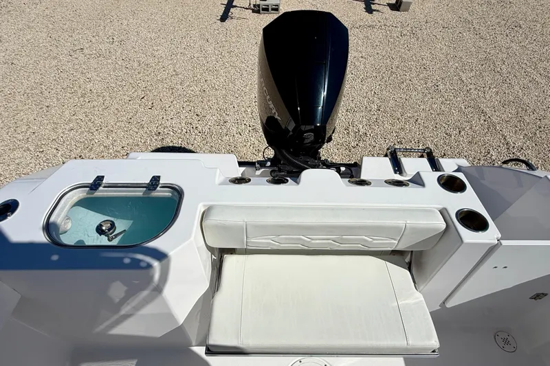 Slide: The Image of 2023 Aquasport 2200 Center Console boat with seating and motor, viewed from above. - 24