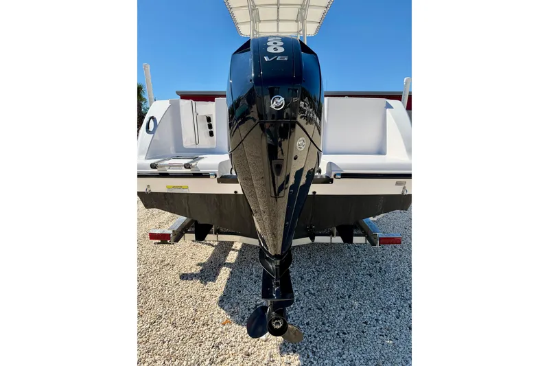 Slide: The Image of 2023 Aquasport 2200 Center Console boat with powerful V6 engine, rear view. - 28