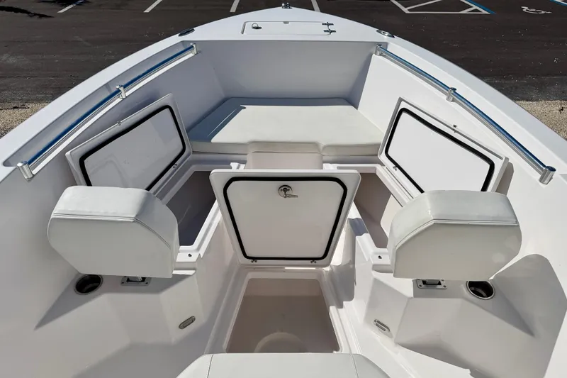 Slide: The Image of 2023 Aquasport 2200 Center Console boat interior with seating and storage compartments. - 9