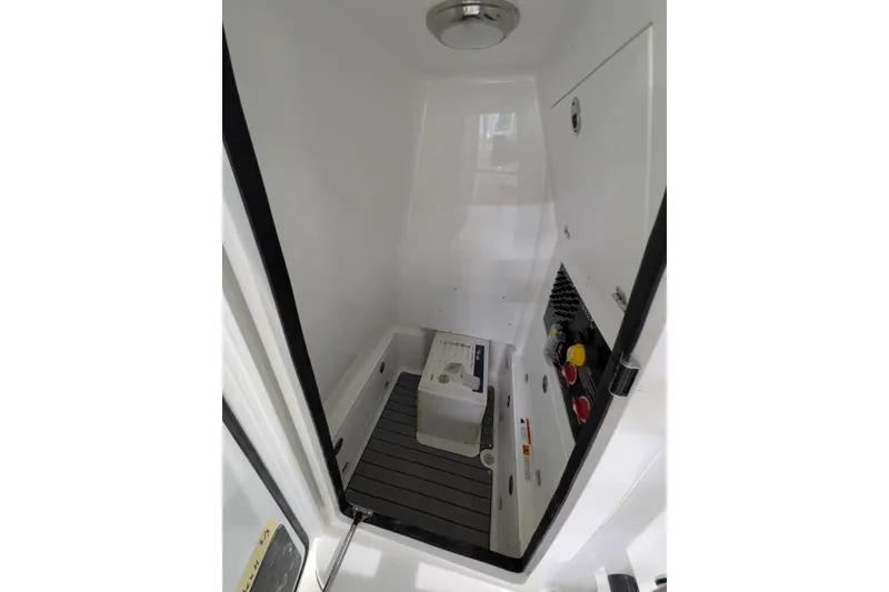 Slide: The Image of Interior of 2026 Caymas 28 HB boat, featuring control panel and storage area. - 10