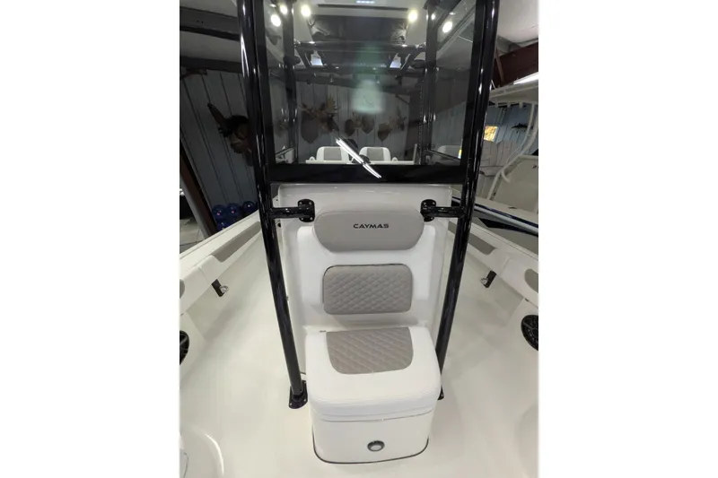 Slide: The Image of 2026 Caymas 28 HB boat interior with cushioned seating and sleek design. - 11