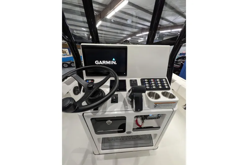 Slide: The Image of 2026 Caymas 28 HB boat console with Garmin display and controls. - 12