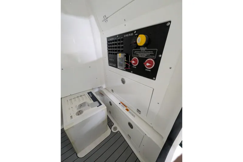 Slide: The Image of 2026 Caymas 28 HB boat interior showing control panel and storage area. - 9