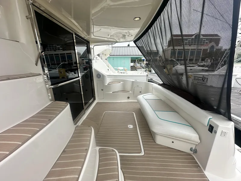 Slide: The Image of 1997 Sea Ray 400 Sedan Bridge yacht interior with seating and steps. - 10