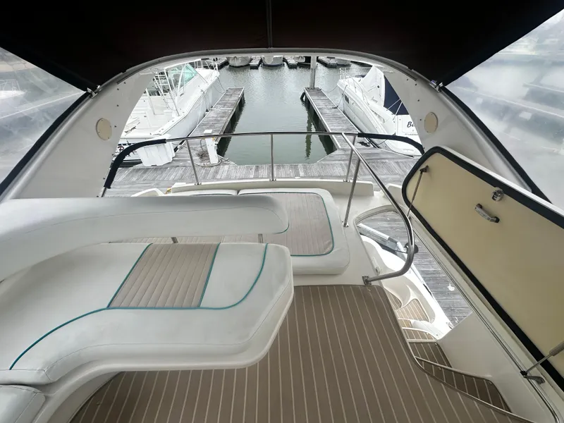 Slide: The Image of 1997 Sea Ray 400 Sedan Bridge yacht interior with marina view. - 15