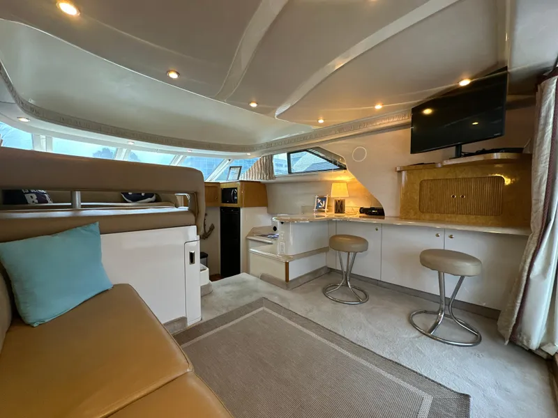 Slide: The Image of Luxurious interior of 1997 Sea Ray 400 Sedan Bridge yacht with modern amenities. - 25