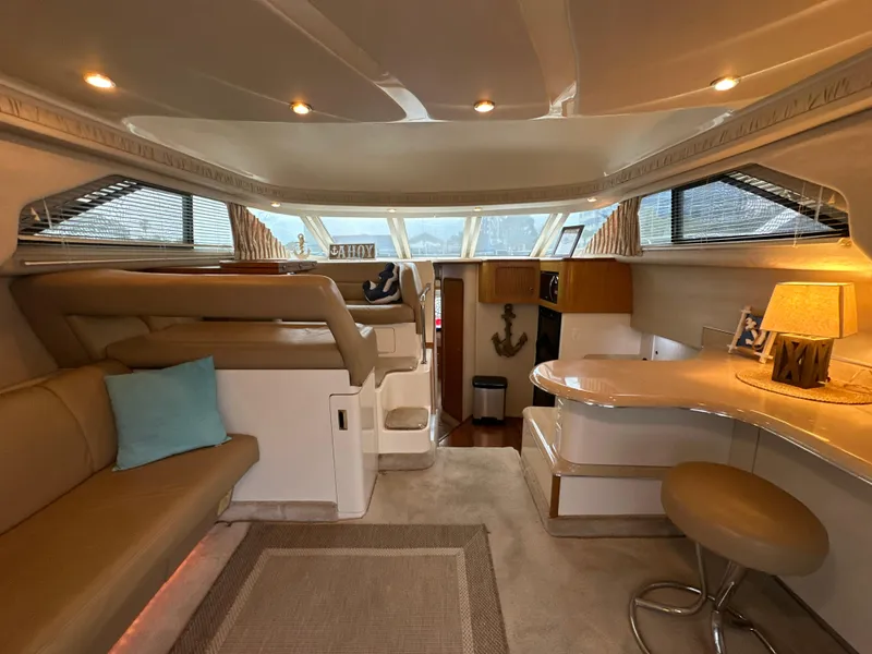 Slide: The Image of Interior of 1997 Sea Ray 400 Sedan Bridge yacht with elegant seating and modern amenities. - 38