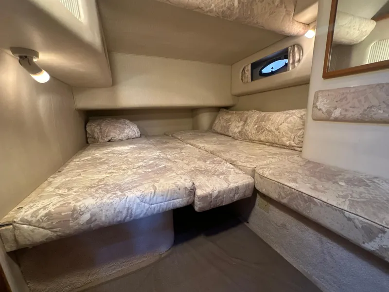 Slide: The Image of Interior cabin of 1997 Sea Ray 400 Sedan Bridge with twin beds and soft lighting. - 45