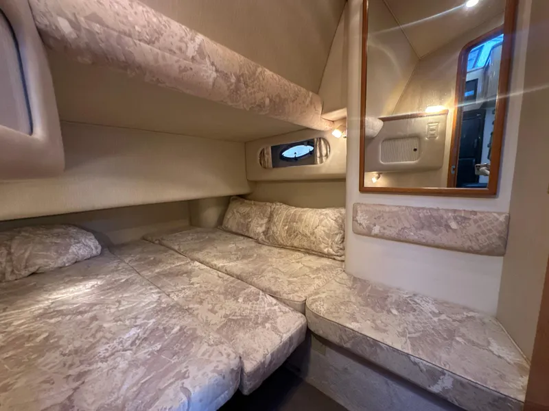 Slide: The Image of Interior of 1997 Sea Ray 400 Sedan Bridge with cozy beds. - 48