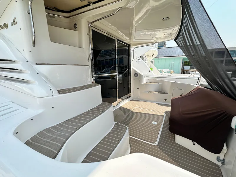 Slide: The Image of 1997 Sea Ray 400 Sedan Bridge yacht interior with stairs and seating area. - 6