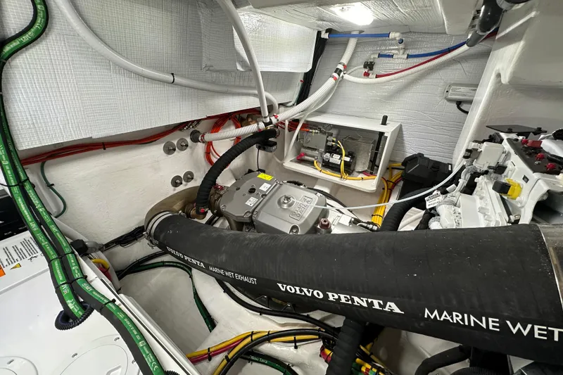 Slide: The Image of Engine room of 2025 Sabre 48 Salon Express with Volvo Penta marine exhaust system. - 12