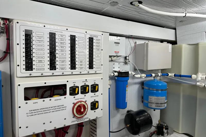 Slide: The Image of Electrical control panel and plumbing system in 2025 Sabre 48 Salon Express yacht. - 14