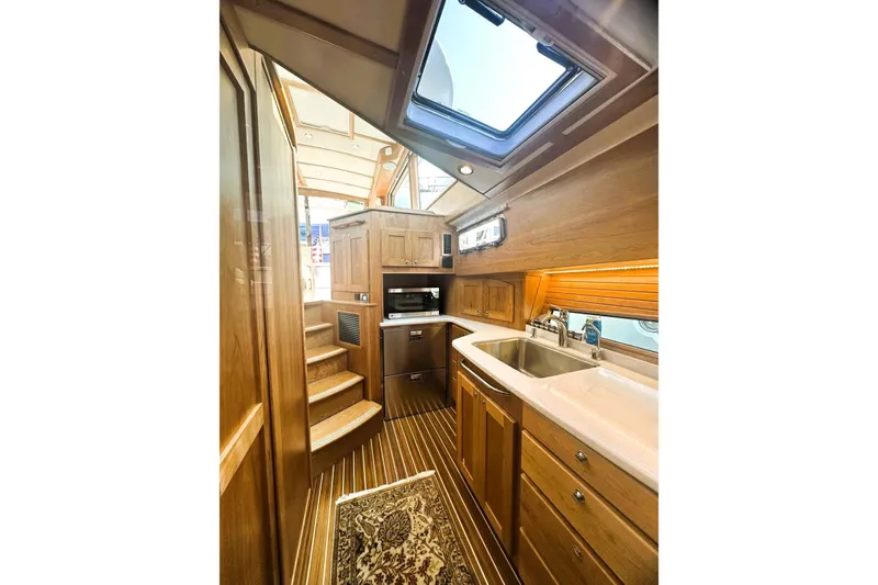 Slide: The Image of Luxurious interior of 2025 Sabre 48 Salon Express yacht with modern kitchen amenities. - 17