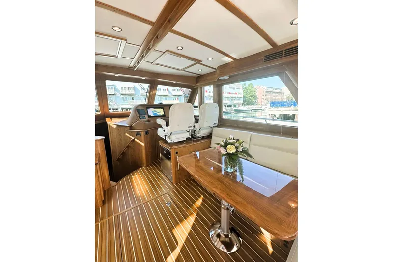 Slide: The Image of Luxurious interior of 2025 Sabre 48 Salon Express yacht with elegant wood finishes. - 20