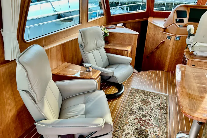 Slide: The Image of Luxurious interior of 2025 Sabre 48 Salon Express yacht with leather seating and wood finish. - 6