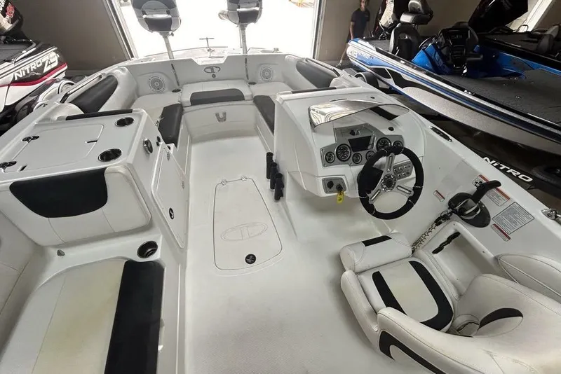 Slide: The Image of 2017 Tahoe 2150 boat interior with steering wheel, seating, and control panel. - 4