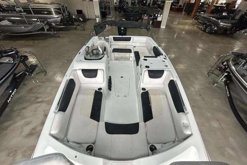 Slide: The Image of 2017 Tahoe 2150 boat interior with spacious seating in showroom. - 8