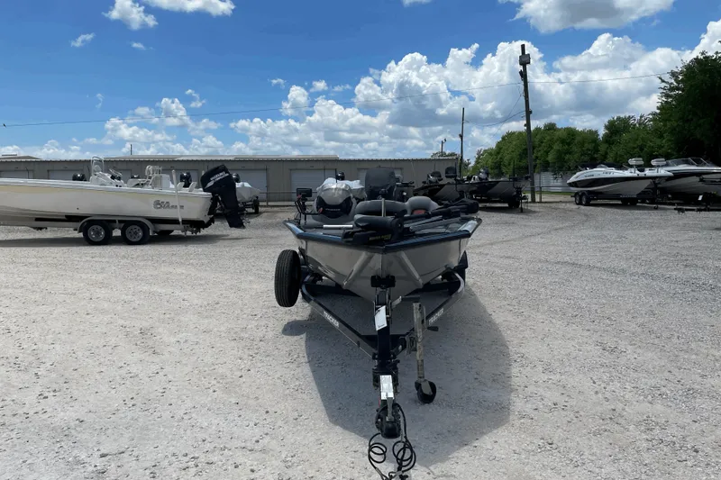 Slide: The Image of 2016 Tracker Pro Team 190 TX boat on trailer in outdoor lot. - 5